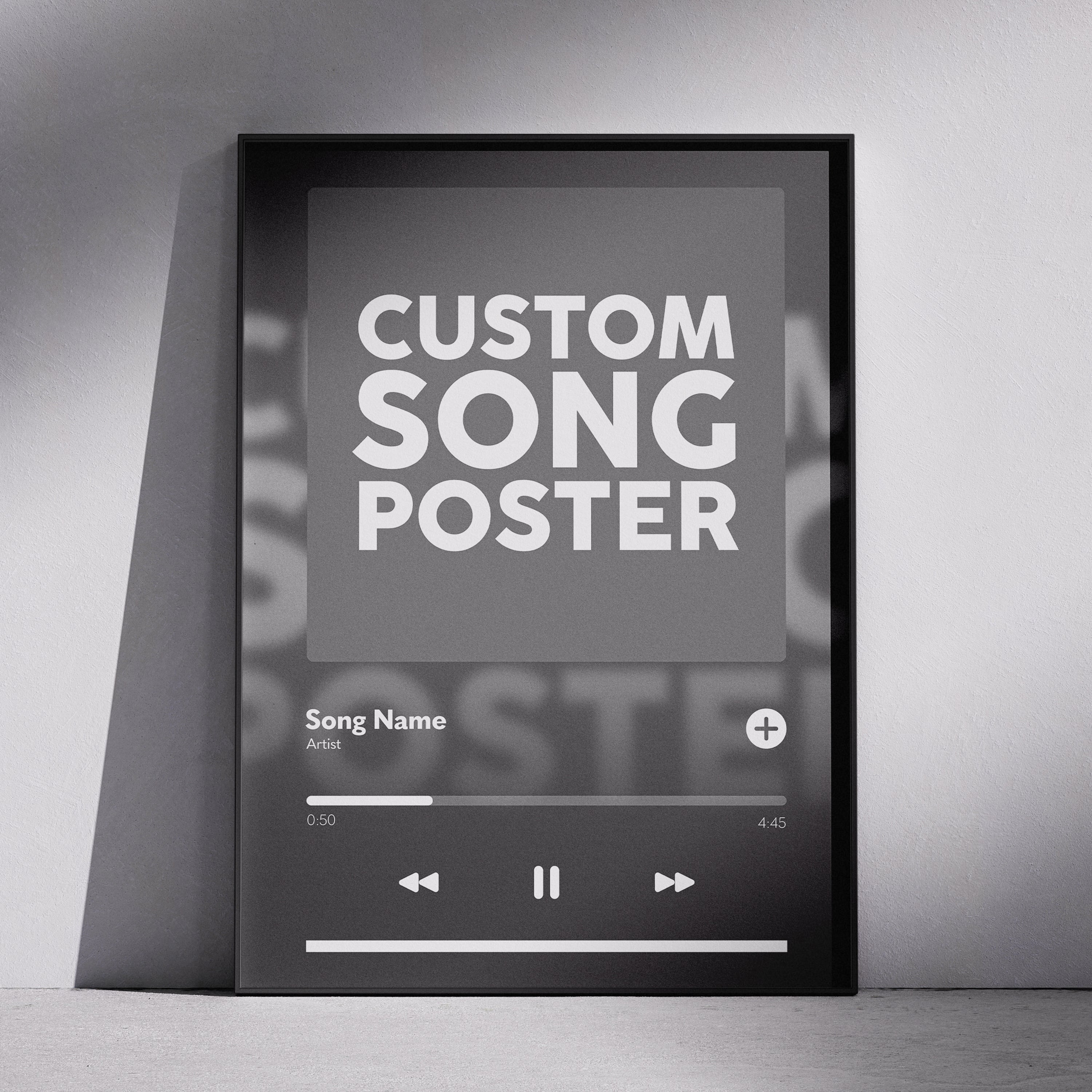 A black-framed poster mockup leaning against a light gray wall. The poster displays a music player interface with the text 'CUSTOM SONG POSTER' in large white letters, along with placeholder text 'Song Name' and playback controls.